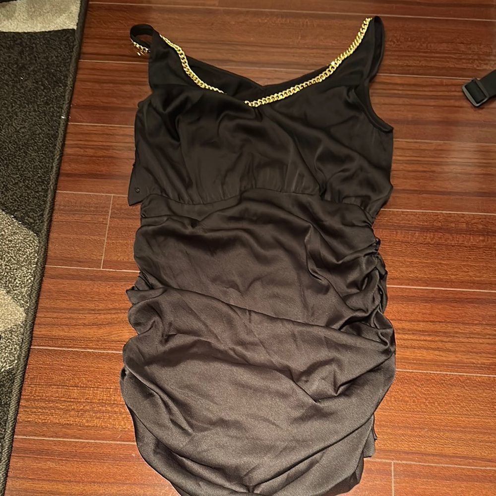 Elegant Black Dress with Gold Chain Detail